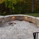 A stone bench with built-in hardscape lighting.